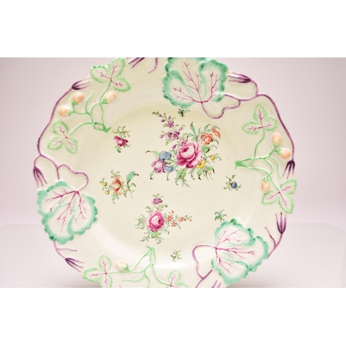 140 - A Longton Hall porcelain strawberry plate, circa 1755-56, the border moulded with leaves and fruitin... 