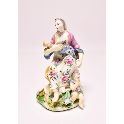 144 - A Bow porcelain model of Charity, circa 1760, the group featuring a seated woman nursing an infant w... 