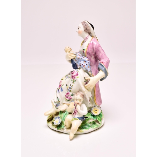 144 - A Bow porcelain model of Charity, circa 1760, the group featuring a seated woman nursing an infant w... 