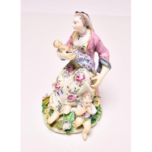 144 - A Bow porcelain model of Charity, circa 1760, the group featuring a seated woman nursing an infant w... 