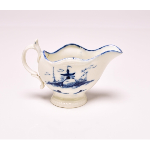 150 - A Caughley cream boat circa 1777-85, of 'gadroon' shape, painted in underglaze blue with the 'Rock H... 