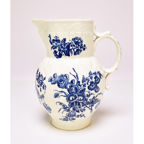 153 - A Caughley 'Bouquets' cabbage leaf maskhead jug, circa 1780-85, transfer-printed in underglaze blue,... 