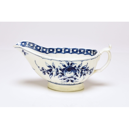 155 - A rare Caughley porcelain 'Rose' sauceboat, circa 1776-80, of fluted low oval form, painted in under... 