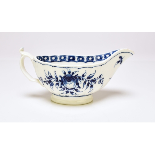 155 - A rare Caughley porcelain 'Rose' sauceboat, circa 1776-80, of fluted low oval form, painted in under... 