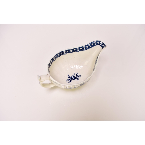 155 - A rare Caughley porcelain 'Rose' sauceboat, circa 1776-80, of fluted low oval form, painted in under... 