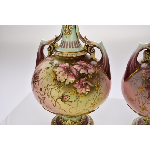 170 - A pair of Royal Worcester prismatic enamel vases, circa 1890, of twin-handled form with satyr masks ... 