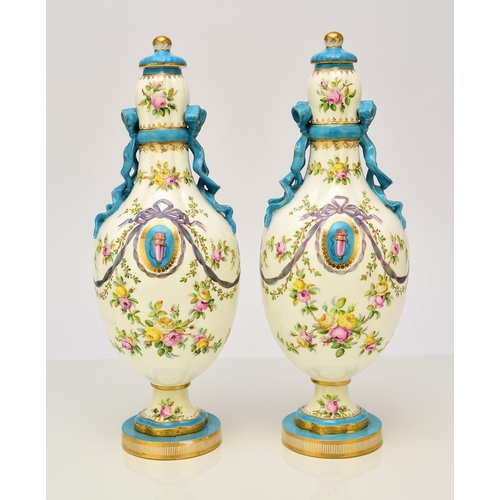 177 - A pair of Coalport ribbon vases and covers, circa 1860 the lobed ovoid forms tied at the bulbous nec... 