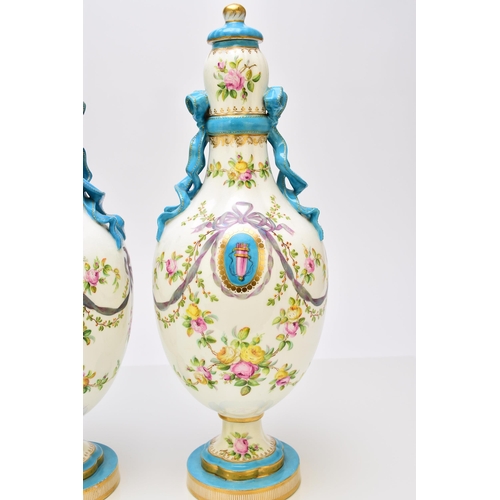 177 - A pair of Coalport ribbon vases and covers, circa 1860 the lobed ovoid forms tied at the bulbous nec... 