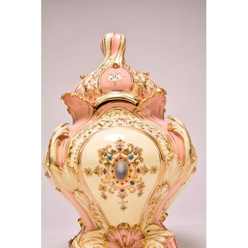 179 - A large and unusual Coalport 'jewelled' vase and cover, circa 1885 of flared bombe form with a twist... 