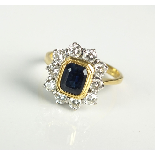 18 - An 18ct gold untested sapphire and diamond cluster ring, designed as a central rectangular faceted s... 