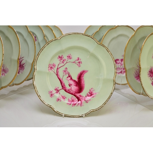 181 - An unusual Coalport dessert service, circa 1860 comprising twelve plates, two low comports and one t... 