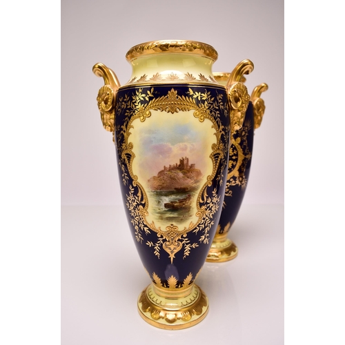 182 - A pair of Coalport vases, circa 1900-10 of tall, ovoid form, with twin rams head handles, the cobalt... 