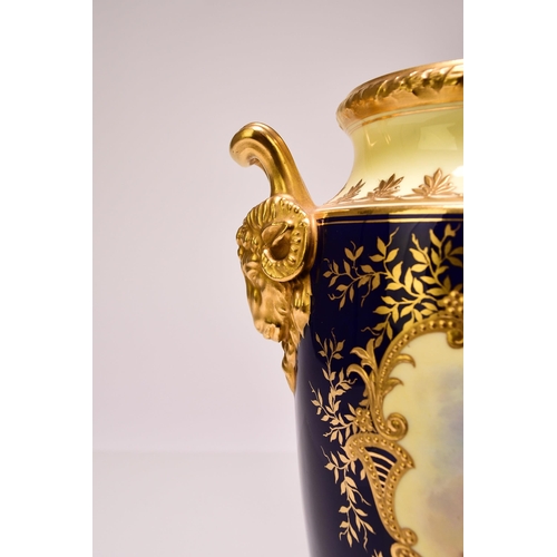 182 - A pair of Coalport vases, circa 1900-10 of tall, ovoid form, with twin rams head handles, the cobalt... 