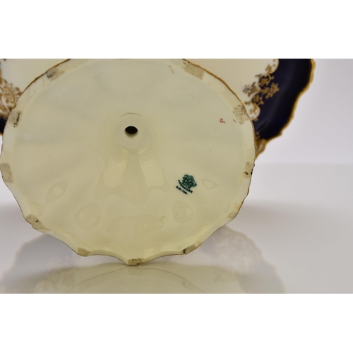 183 - A Coalport dessert service, circa 1891-1919 of wavy, circular form, each individually painted with a... 