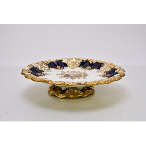 183 - A Coalport dessert service, circa 1891-1919 of wavy, circular form, each individually painted with a... 