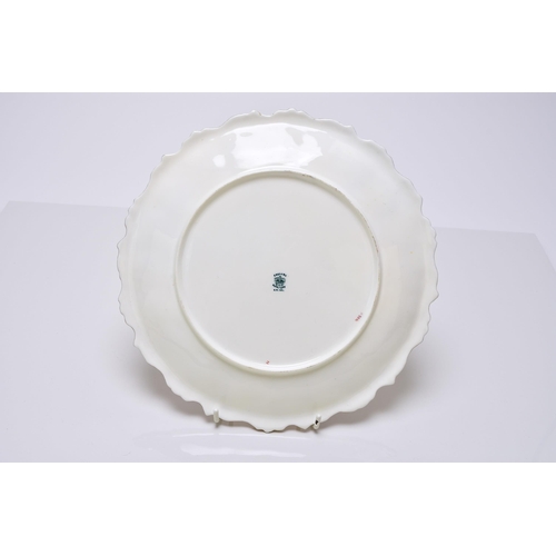 183 - A Coalport dessert service, circa 1891-1919 of wavy, circular form, each individually painted with a... 