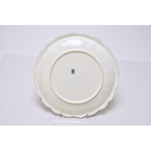 183 - A Coalport dessert service, circa 1891-1919 of wavy, circular form, each individually painted with a... 