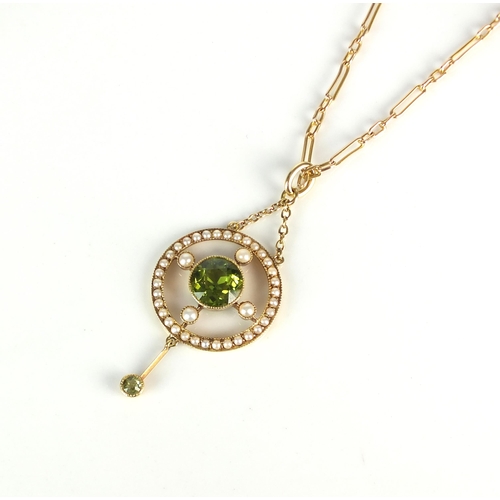 19 - An early 20th century peridot and seed pearl pendant on chain, designed as a central round mixed cut... 