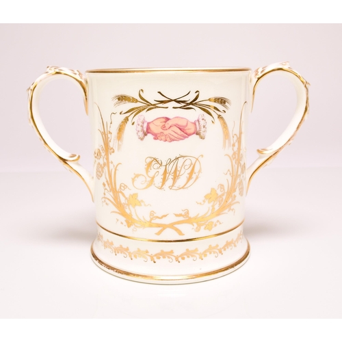 193 - A rare Coalport presentation loving cup, circa 1860 with feather moulded and gilt loop handles, prin... 