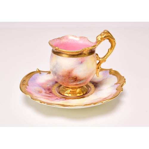 194 - A Coalport cabinet cup and saucer, circa 1910-15 the pink and yellow agate or faux marble ground wit... 