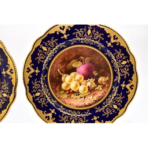 198 - A pair of Coalport scalloped cabinet plates, circa 1920, painted with still lives of fruit by Freder... 