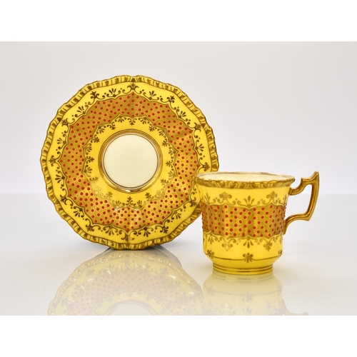 202 - A Coalport 'jewelled' cabinet cup and saucer, circa 1900-10 of fluted form, the lemon yellow ground ... 