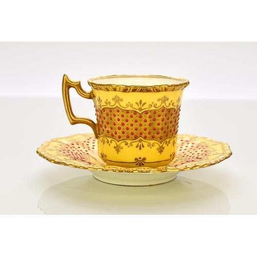 202 - A Coalport 'jewelled' cabinet cup and saucer, circa 1900-10 of fluted form, the lemon yellow ground ... 