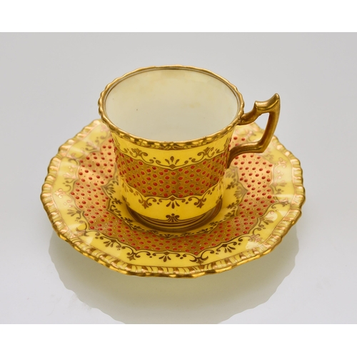 202 - A Coalport 'jewelled' cabinet cup and saucer, circa 1900-10 of fluted form, the lemon yellow ground ... 