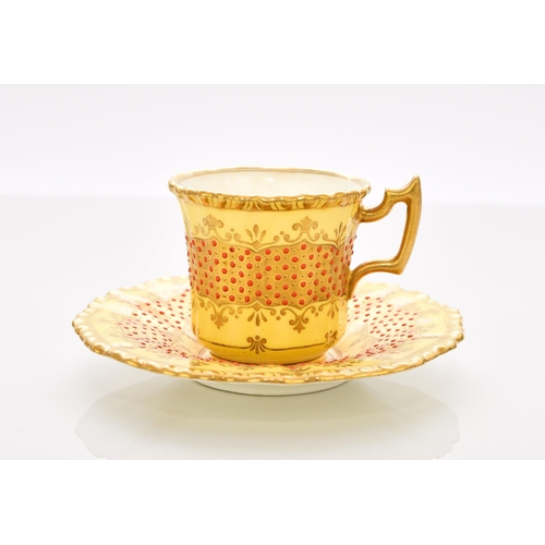 202 - A Coalport 'jewelled' cabinet cup and saucer, circa 1900-10 of fluted form, the lemon yellow ground ... 