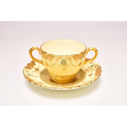 203 - A Coalport 'jewelled' twin-handled cup and saucer, early 20th century the pale turquoise jewels set ... 