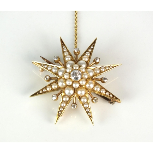 21 - An early 20th century diamond and split seed pearl starburst pendant / brooch, designed as a central... 