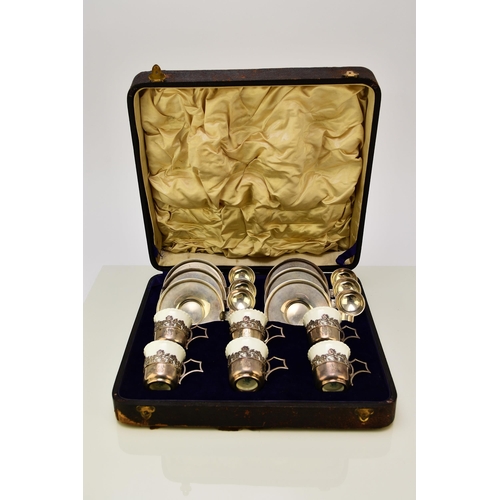 215 - A cased silver-mounted Coalport coffee service, with unusual silver saucers and teaspoon holders, ha... 