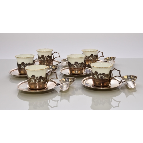 215 - A cased silver-mounted Coalport coffee service, with unusual silver saucers and teaspoon holders, ha... 