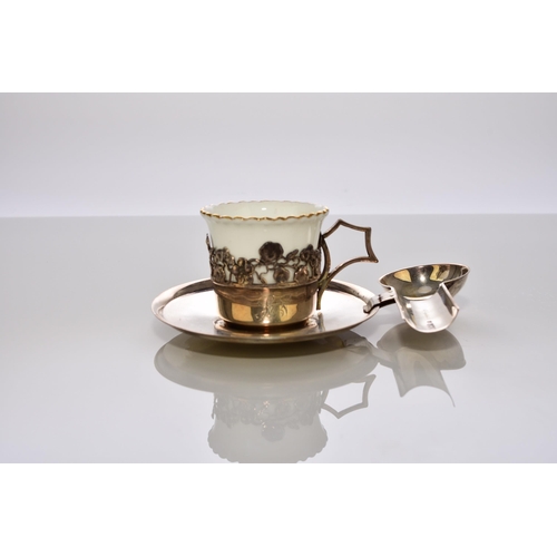 215 - A cased silver-mounted Coalport coffee service, with unusual silver saucers and teaspoon holders, ha... 