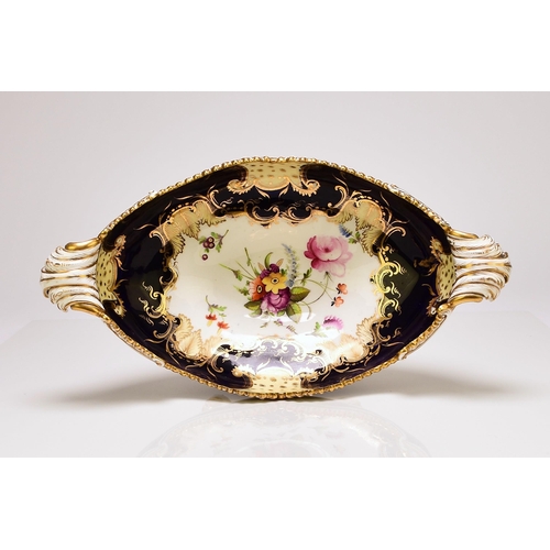 220 - An unusual standing Coalport dessert centrepiece, circa 1830 of twin-handled form, raised on four fe... 