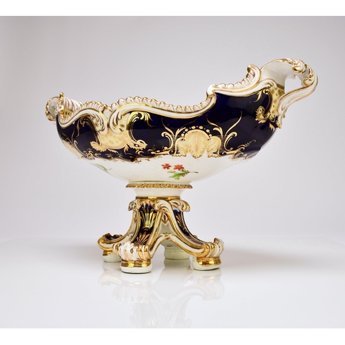 220 - An unusual standing Coalport dessert centrepiece, circa 1830 of twin-handled form, raised on four fe... 