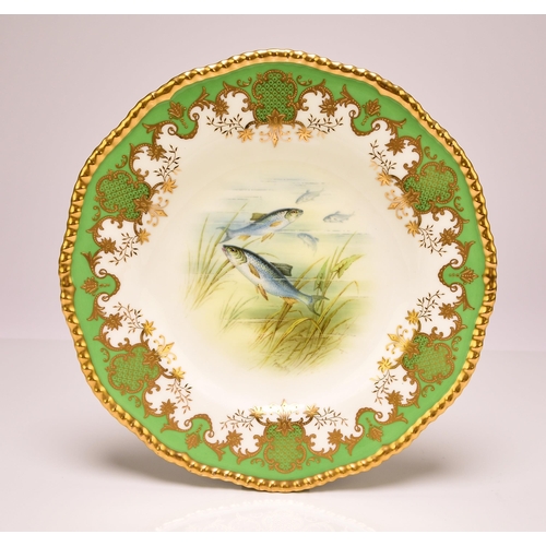 227 - A set of four Coalport ichthyological dessert plates, early 20th century apple green and gilt border... 