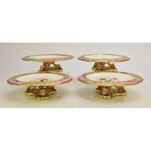 228 - A Coalport dessert service, circa 1860 comprising ten plates and four comports, centrally painted in... 