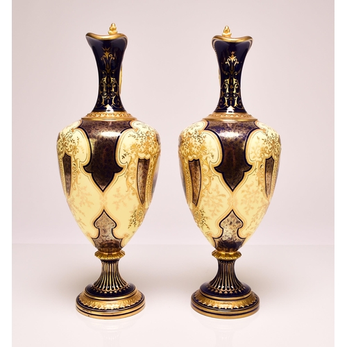 232 - A pair of good quality Coalport ewers, early 20th century, of baluster form with gilt scrolling hand... 