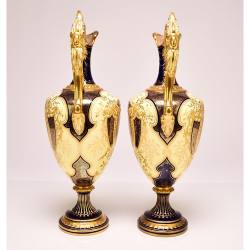 232 - A pair of good quality Coalport ewers, early 20th century, of baluster form with gilt scrolling hand... 