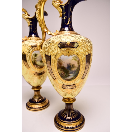 232 - A pair of good quality Coalport ewers, early 20th century, of baluster form with gilt scrolling hand... 