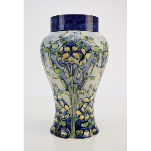 240 - William Moorcroft for Macintyre & Co, a 'Florian' violets vase, circa 1900-02, of high shouldered ba... 