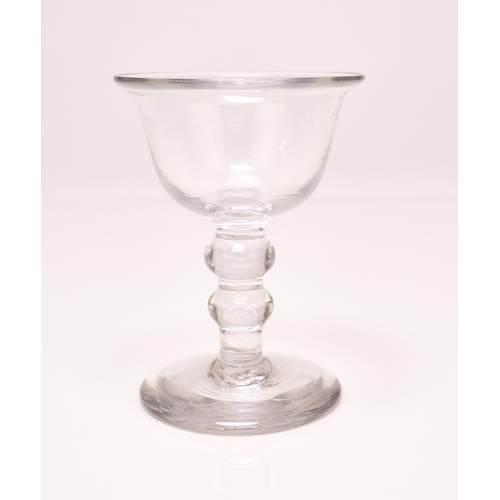 244 - A small English sweetmeat glass, circa 1750, the bell bowl with an averted rim, set above a clear do... 