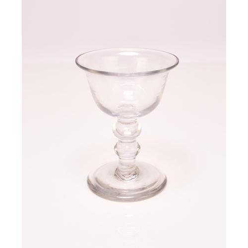 244 - A small English sweetmeat glass, circa 1750, the bell bowl with an averted rim, set above a clear do... 