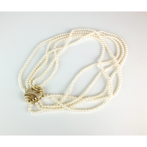 28 - A five strand uniform cultured pearl necklace, with oval yellow metal diamond set clasp, stamped '75... 