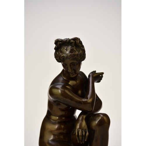 314 - A bronze figure of the crouching Venus, after the antique The nude figure in kneeling position besid... 