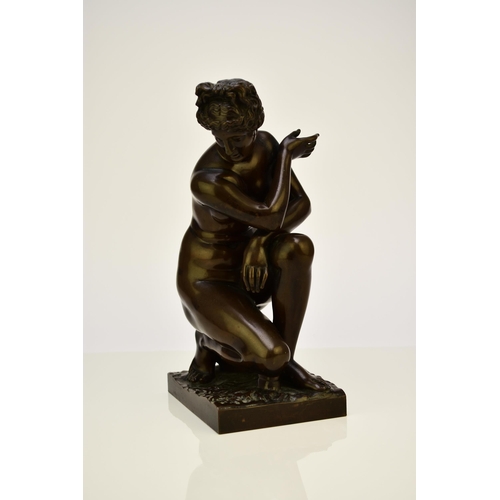 314 - A bronze figure of the crouching Venus, after the antique The nude figure in kneeling position besid... 