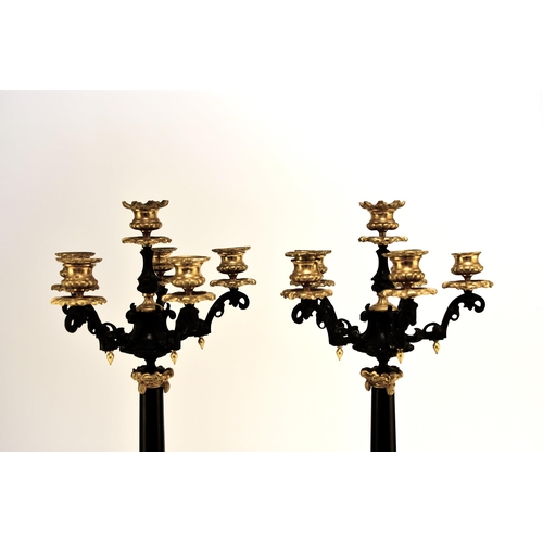 316 - A pair of bronze, ormolu and marble candelabra, late 19th century With five scroll branches having g... 