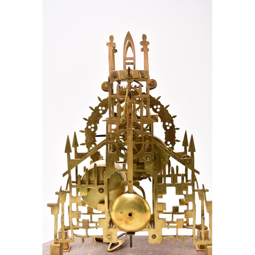 322 - A late 19th century lacquered brass skeleton timepiece with original dome The elaborate Gothic influ... 