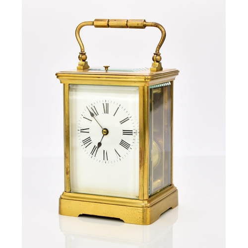 329 - A French brass carriage clock with repeat, early 20th century The case with carrying handle, the 2 1... 